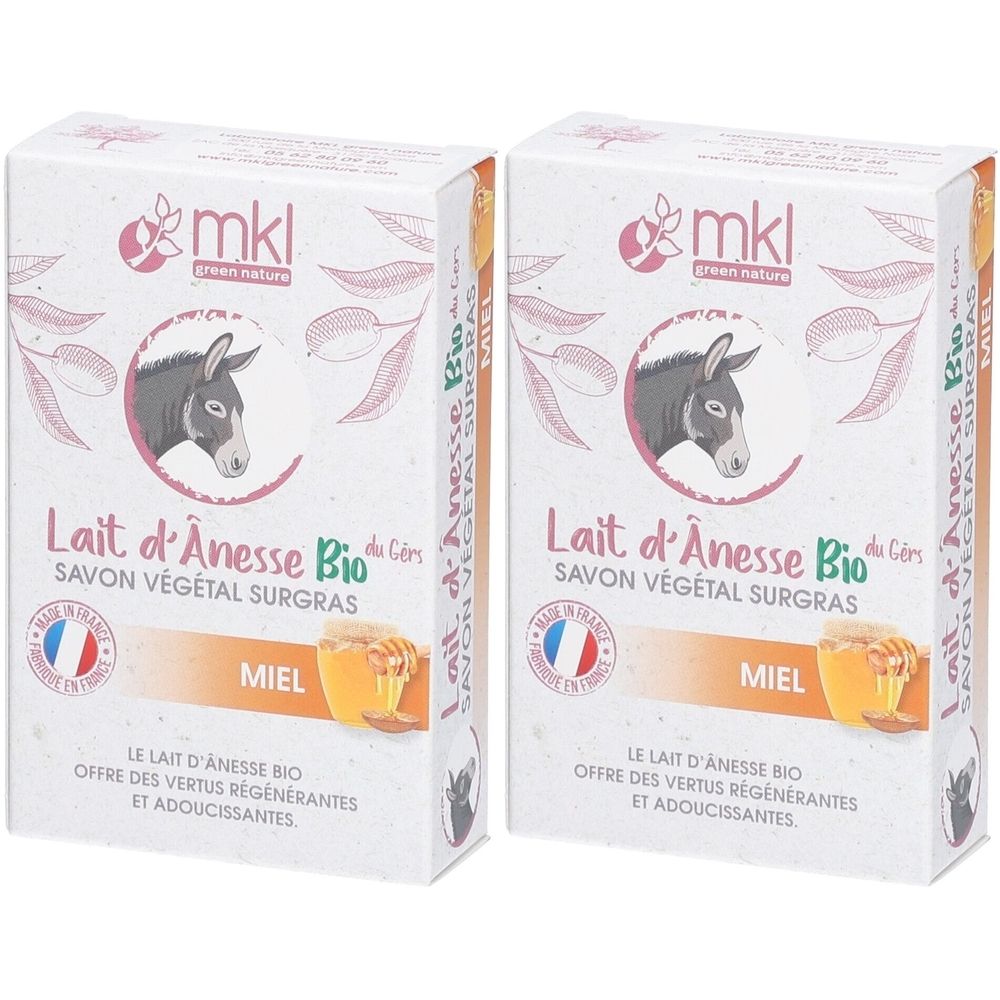 Deux boîtes de savon rectangulaires. Inscription : "Lait d'Ânesse Bio", "Miel", logo avec âne. Drapeau français.