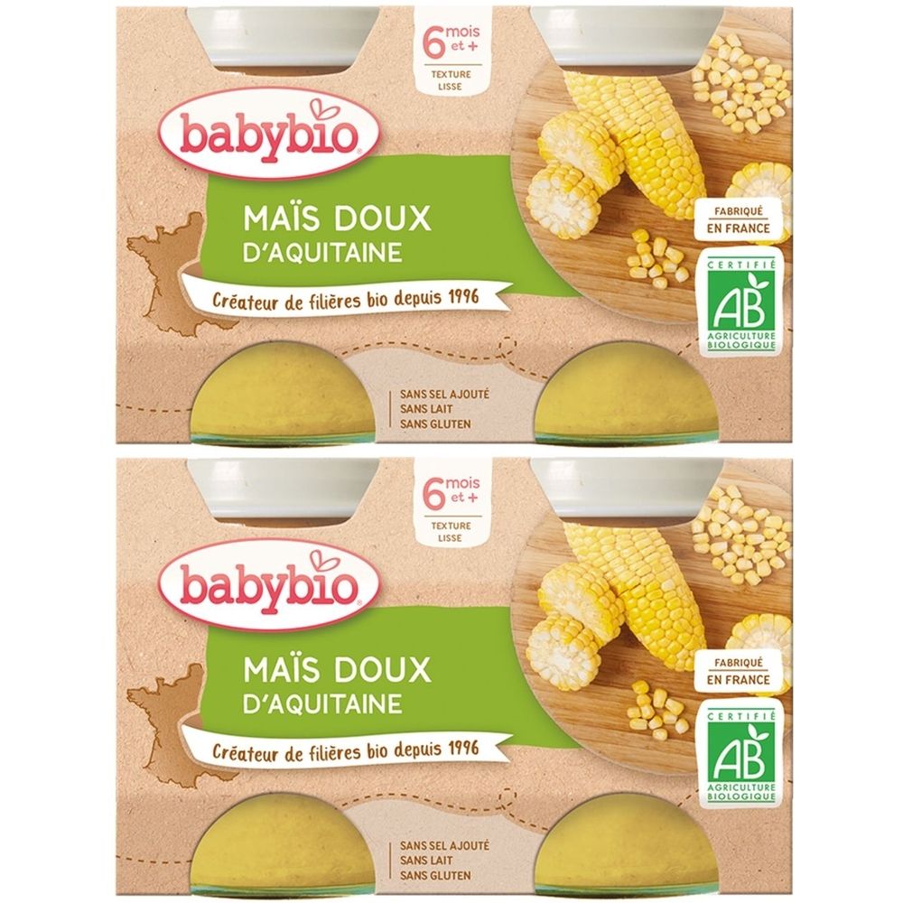 Emballage Babybio Maïs Doux d'Aquitaine. Inscriptions: 6 mois+, texture lisse, label AB, sans sel, lait, gluten. Épis de maïs illustrés.