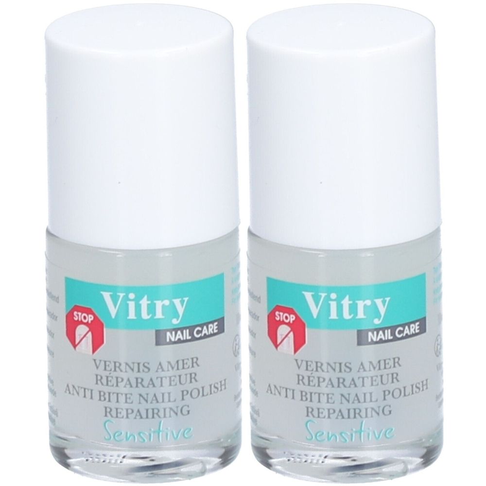 Deux flacons de vernis à ongles. Bouchon blanc, flacon transparent avec étiquette bleu et blanc. Inscription : Vitry, Vernis Amer, Reparateur, Sensitive.