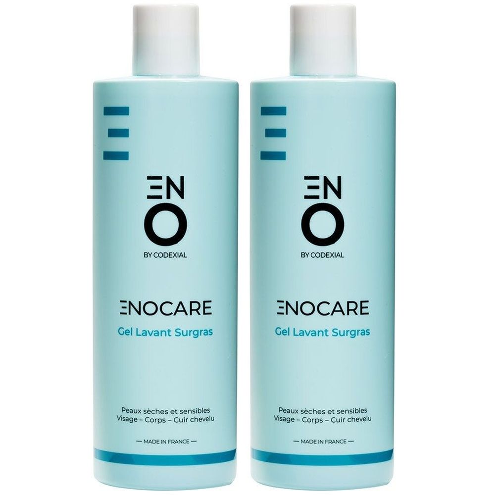 Deux flacons bleu clair avec bouchon blanc. Inscription: ENO, ENOCARE, Gel Lavant Surgras. Pour peaux sèches et sensibles.