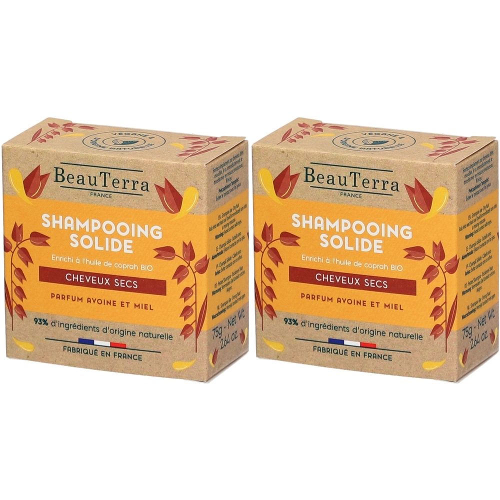 Deux boîtes rectangulaires. Inscription: BeauTerra, Shampoing Solide, Cheveux Secs, Parfum Avoine et Miel. 93% ingrédients d'origine naturelle. Fabriqué en France.