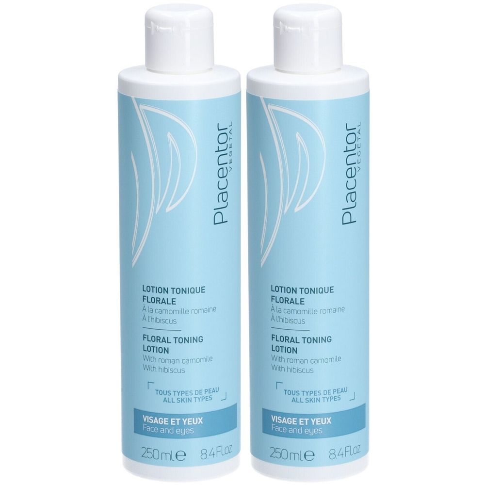 Deux flacons de Placentor VEGETAL LOTION TONIQUE FLORALE. Flacons bleu clair avec bouchon blanc. Texte: FLORALE, VISAGE ET YEUX, ALL SKIN TYPES.