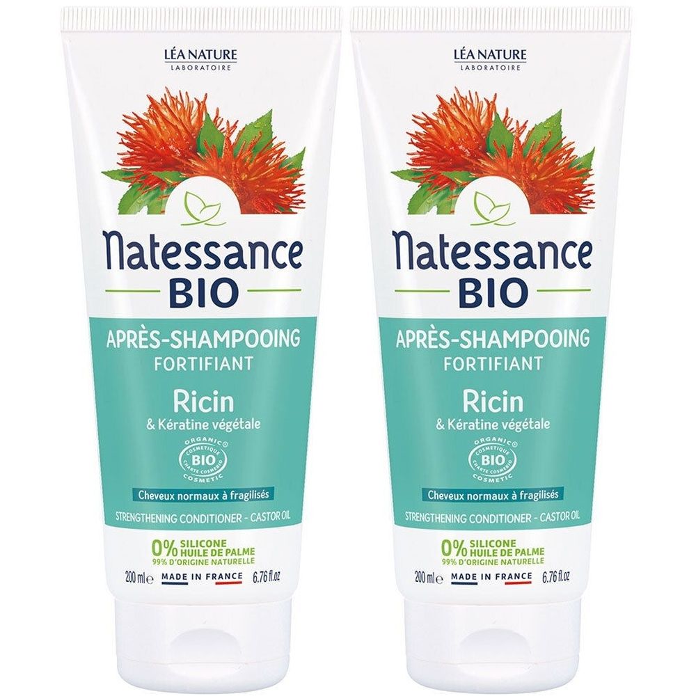 Deux tubes de revitalisant capillaire Natessance BIO. Tubes blancs avec éléments verts et orange. Texte: Ricin & Kératine végétale, Après-Shampooing Fortifiant.