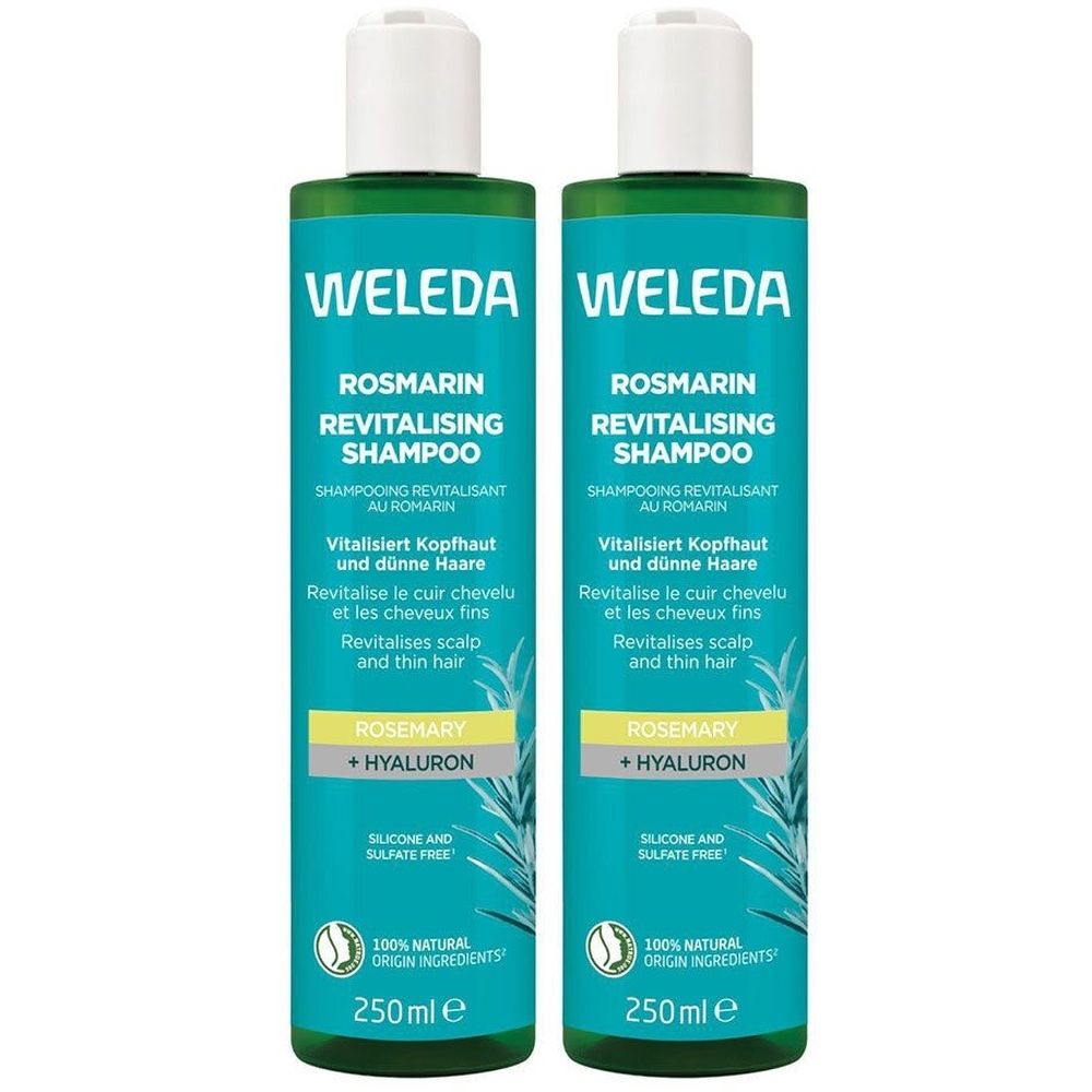Deux flacons de shampooing revitalisant au romarin Weleda. Flacons turquoise avec bouchon blanc. Texte : Romarin, Hyaluron, 250ml.