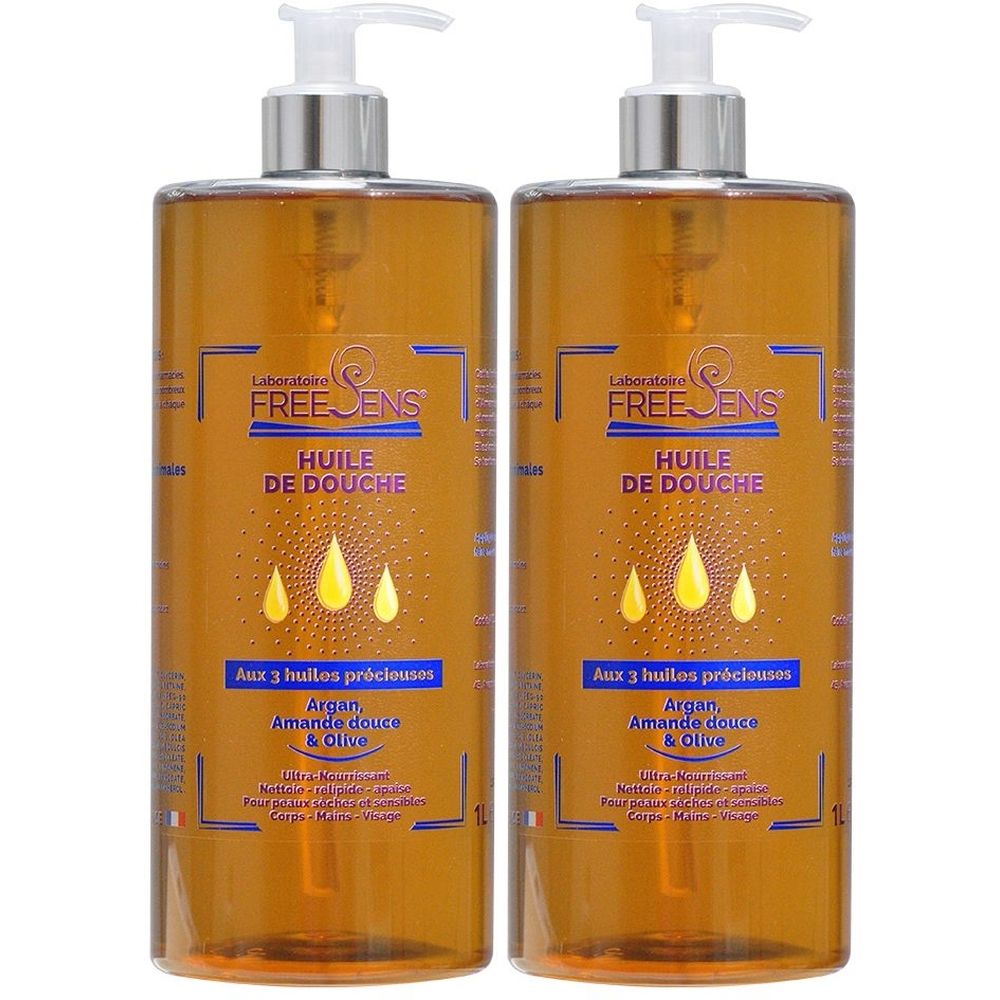 Deux flacons de Freesens Huile de Douche. Liquide brun dans des flacons transparents avec pompe. Inscription: Huile de Douche, Aux 3 huiles précieuses.