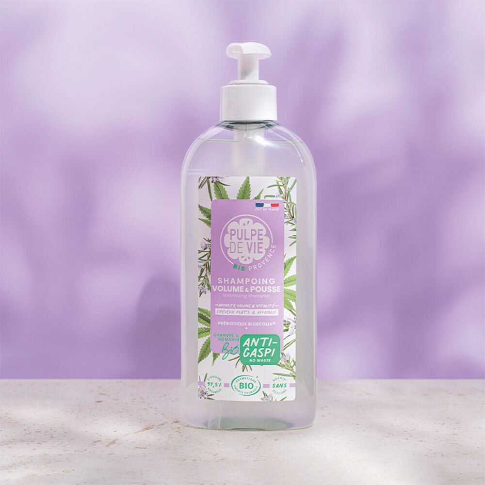 Flacon transparent avec pompe. Étiquette avec nom et logo du produit. Certification bio.