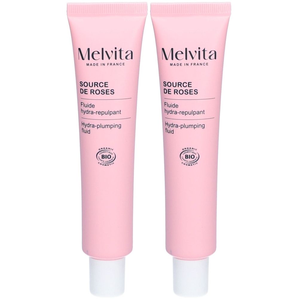 Deux tubes roses avec bouchon blanc. Inscription: Melvita, Source de Roses, Fluide hydra-repulpant, Hydra-plumping fluid. Label Bio.