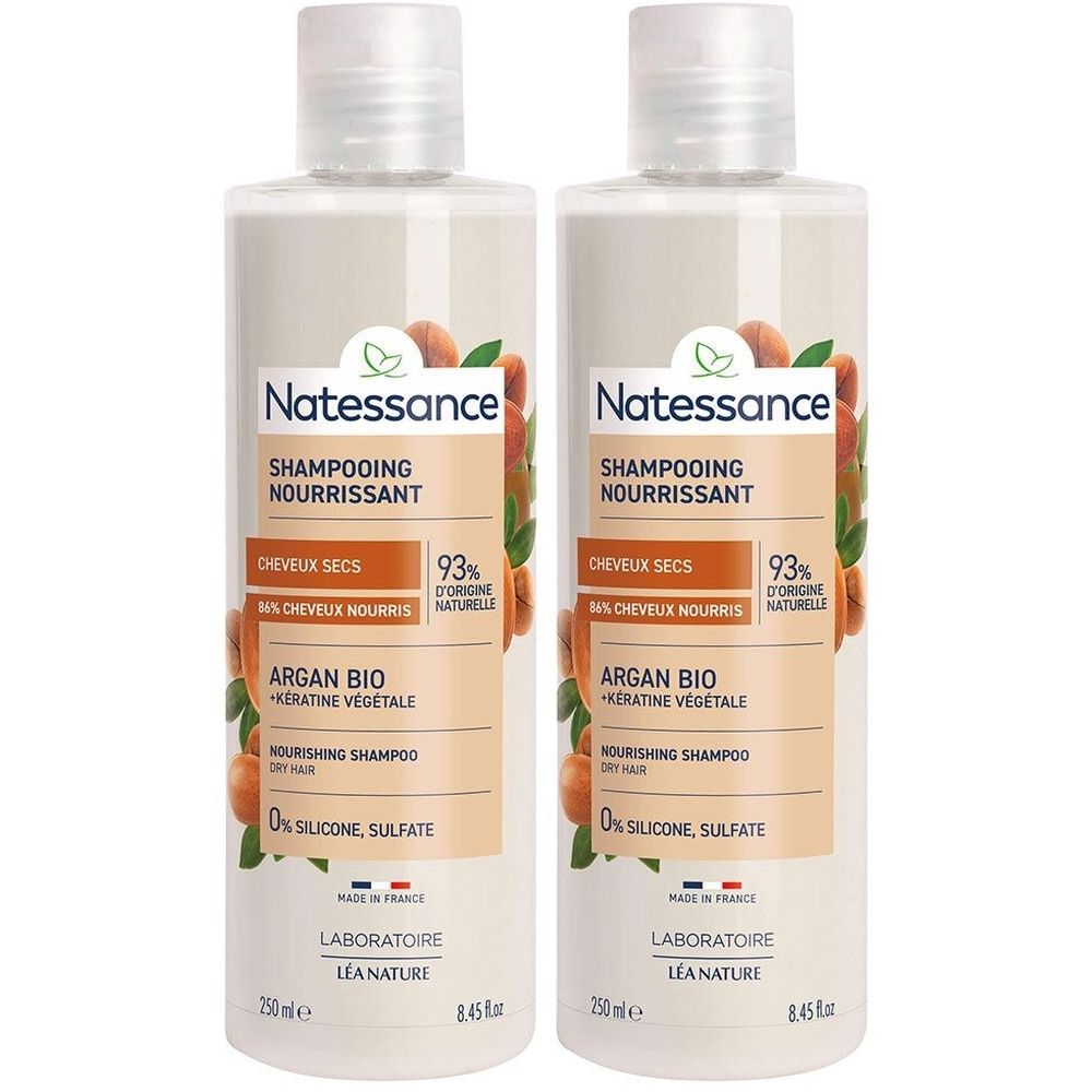 Deux flacons de shampooing. Inscription: Natessance, Shampooing Nourrissant, Argan Bio + Kératine Végétale. 0% silicone, sulfate.