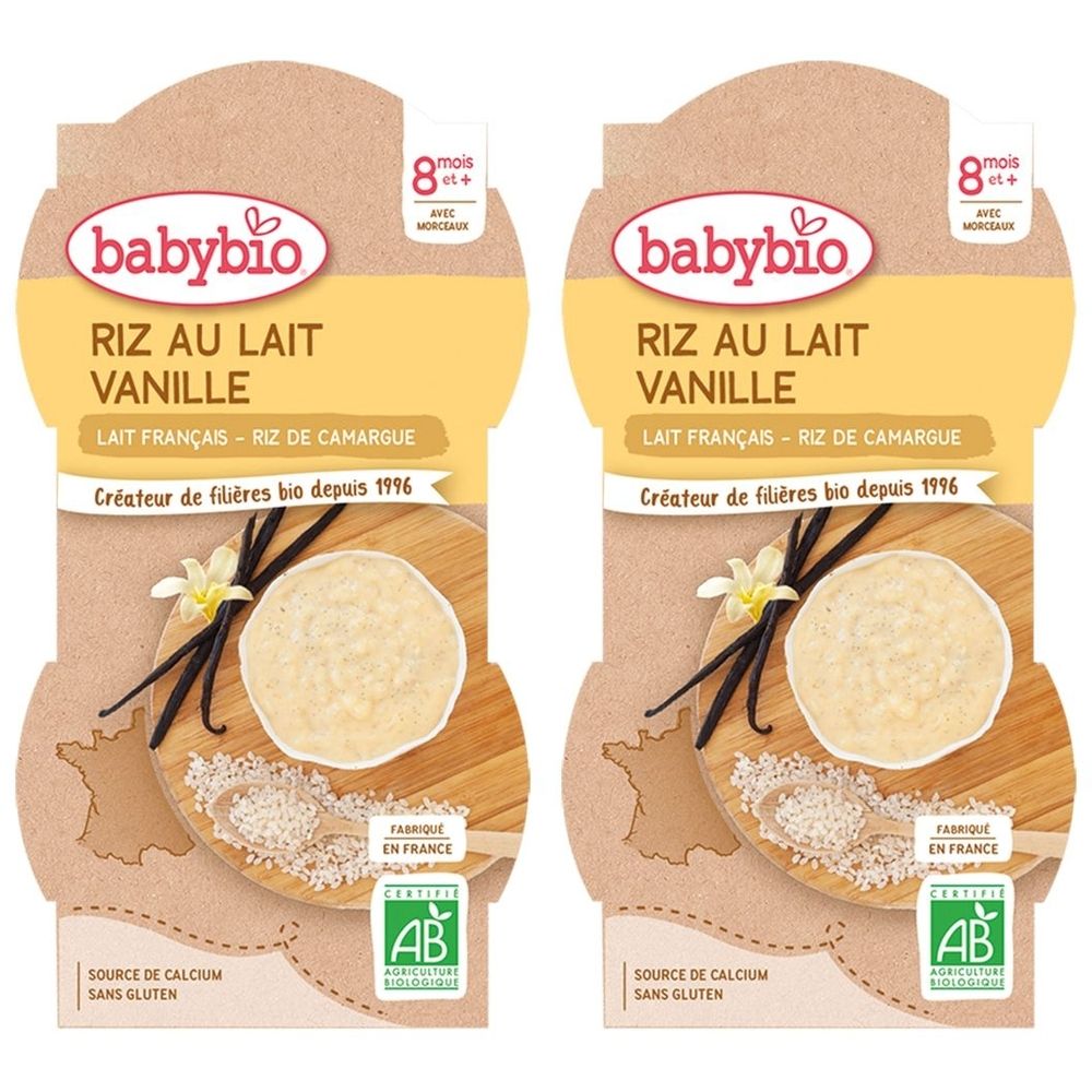 Deux emballages Babybio RIZ AU LAIT VANILLE. Inscriptions: 8 mois+, Lait Français, Riz de Camargue, label AB, sans gluten.