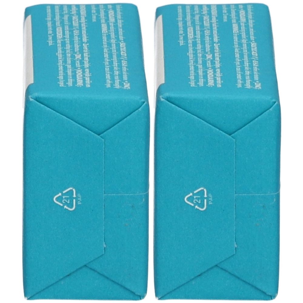 Deux emballages turquoise rectangulaires. Inscription et symbole de recyclage. Emballage en papier.