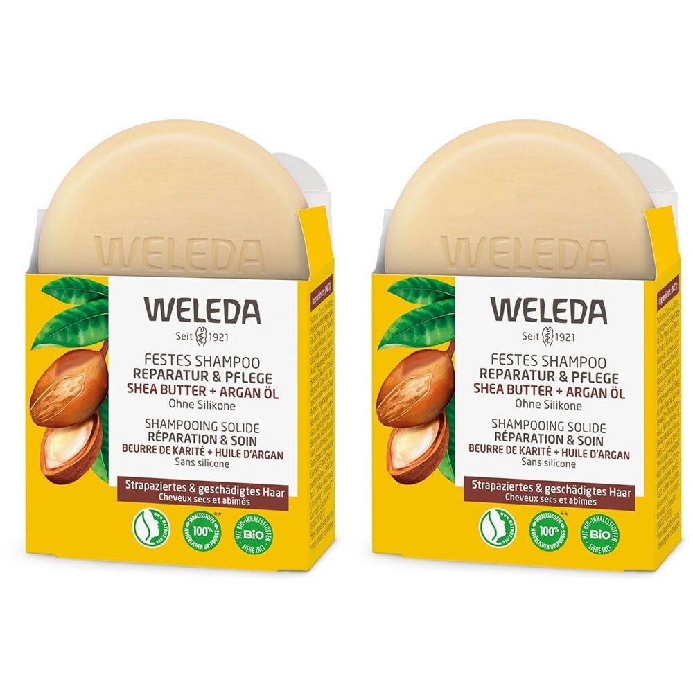 Deux shampoings solides ronds dans des emballages jaunes. Inscription : WELEDA, Shampooing solide, Beurre de Karité + Huile d'Argan. Pour cheveux abîmés.