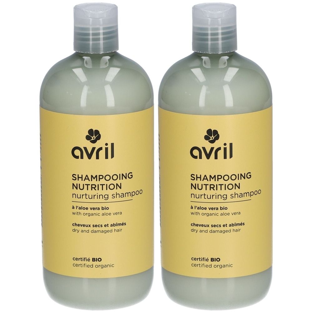 Deux flacons de shampooing. Étiquettes jaunes avec texte noir: "avril SHAMPOOING NUTRITION nurturing shampoo". Certifié BIO.