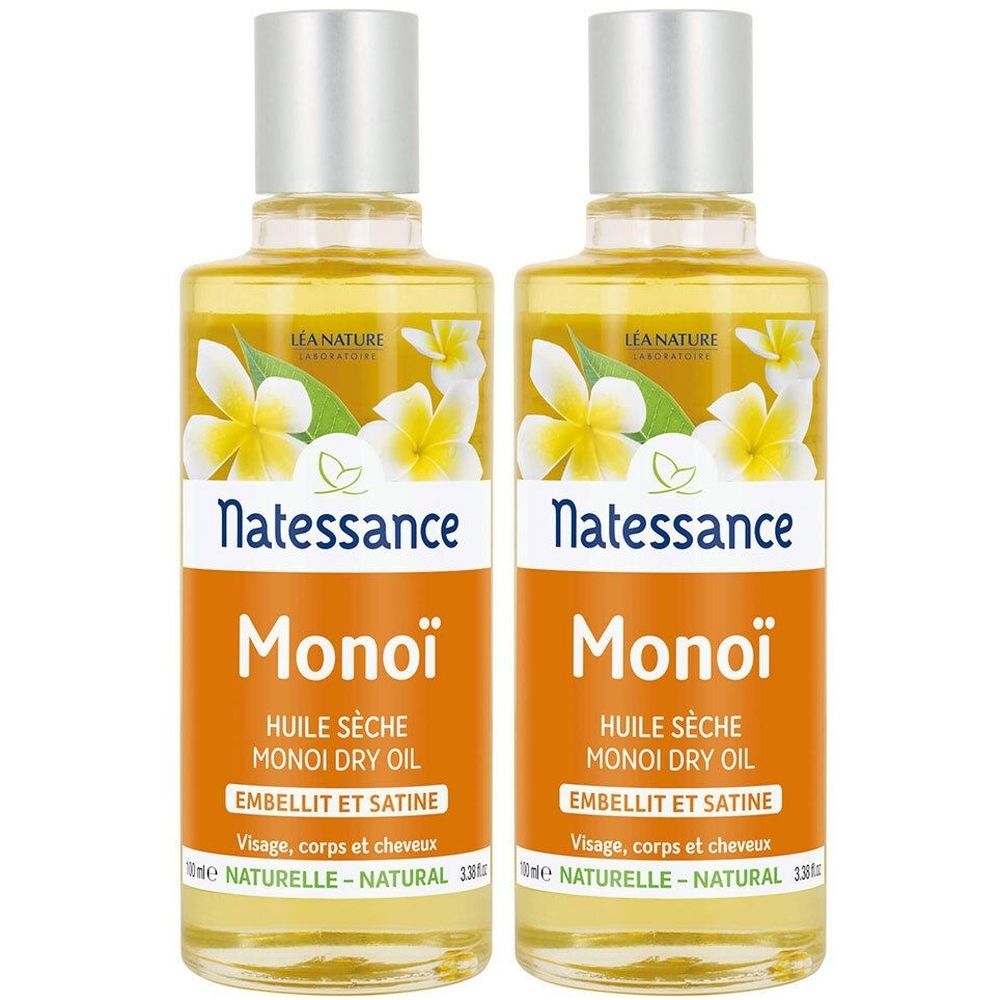Deux flacons de liquide jaune. Étiquettes "Natessance Monoï Huile Sèche". Bouchons argentés et décor floral. Texte: "Visage, corps et cheveux".