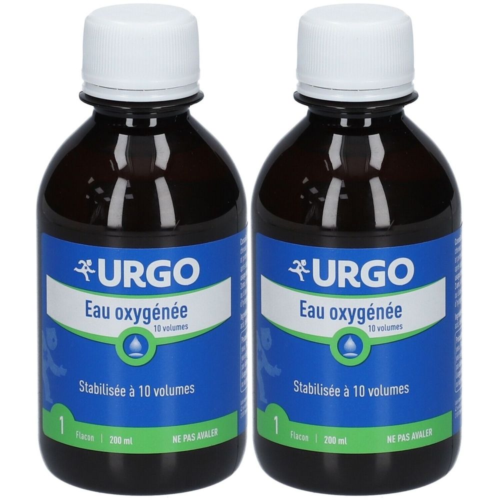 Deux flacons en verre brun avec bouchons blancs. Étiquettes bleues avec texte: URGO Eau oxygénée, Stabilisée à 10 volumes. Flacons côte à côte.
