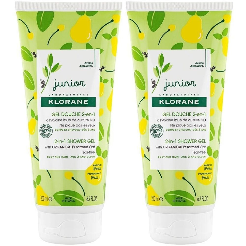 Deux tubes de gel douche. Inscription: KLORANE Junior, 2-en-1 Shower Gel, avec avoine bio. Design vert et jaune avec motif de poires. Bouchon blanc.