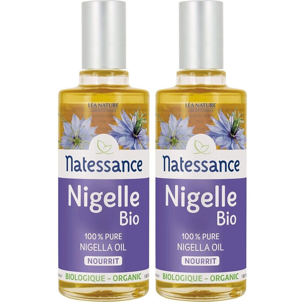 Deux flacons d'huile jaune. Les étiquettes indiquent "Natessance Nigelle Bio 100% Pure Nigella Oil".