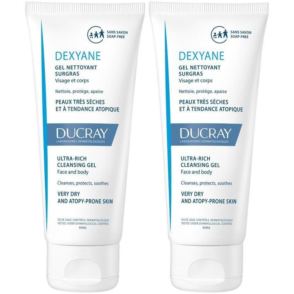 Deux tubes de DUCRAY DEXYANE Gel nettoyant surgras. Tubes blancs avec texte bleu. Texte: Ultra-Rich Cleansing Gel, pour le visage et le corps.