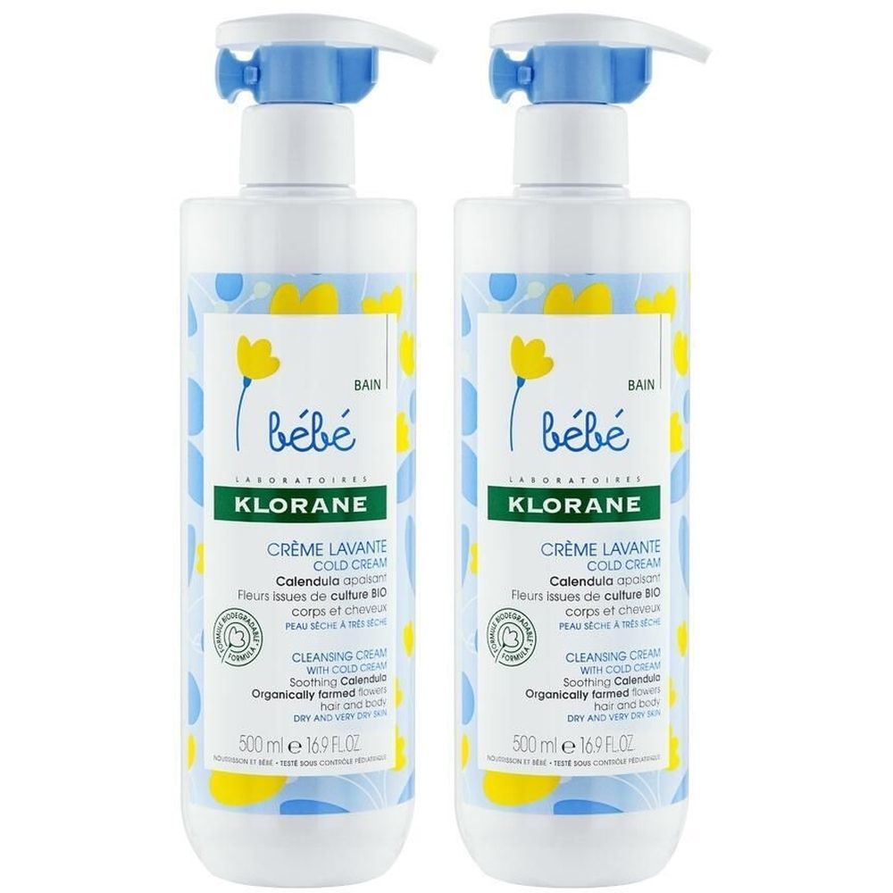 Deux flacons de Klorane Bébé Crème lavante Cold Cream. Flacons blancs avec pompe bleue et étiquette avec fleurs jaunes. Texte: Bébé, Klorane.