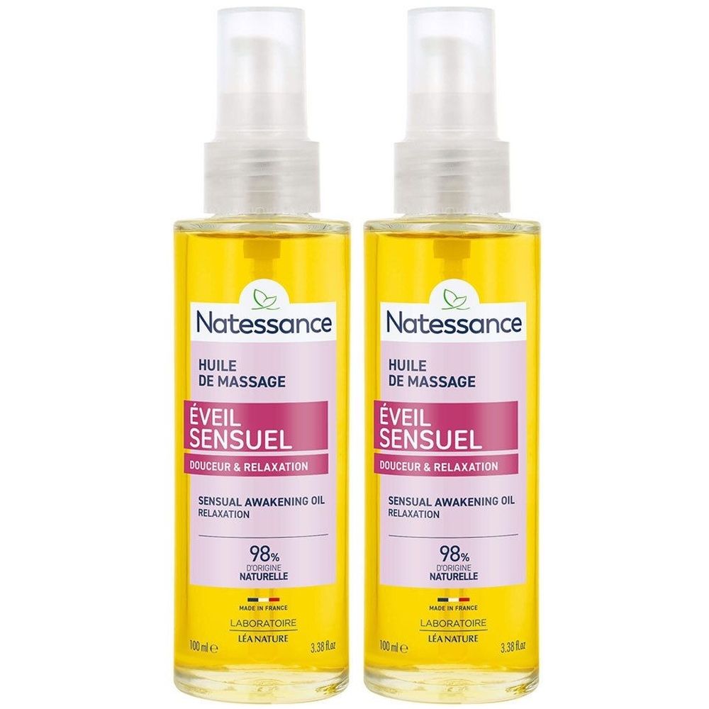 Deux flacons d'huile de massage Natessance. Liquide jaune dans des flacons transparents avec vaporisateur. Étiquette avec nom et informations.