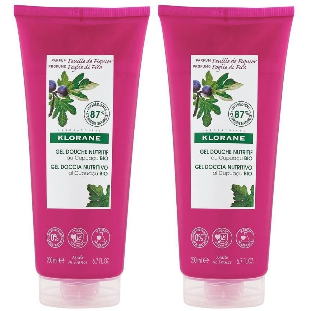 Deux tubes de gel douche KLORANE. Emballage rose avec nom du produit et illustration de feuilles de figuier. Contient 87% d'ingrédients d'origine naturelle.