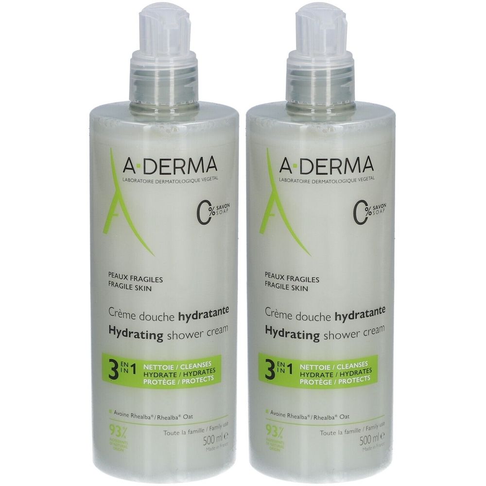 Deux flacons de crème de douche A-Derma. Flacons blancs avec pompe. Inscription : Crème douche hydratante, Hydrating shower cream, 3 en 1.