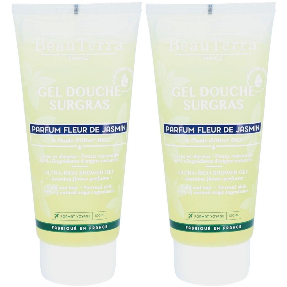 Deux tubes de gel douche. Inscription: GEL DOUCHE SURGRAS, PARFUM FLEUR DE JASMIN. Bouchon blanc, accents verts.