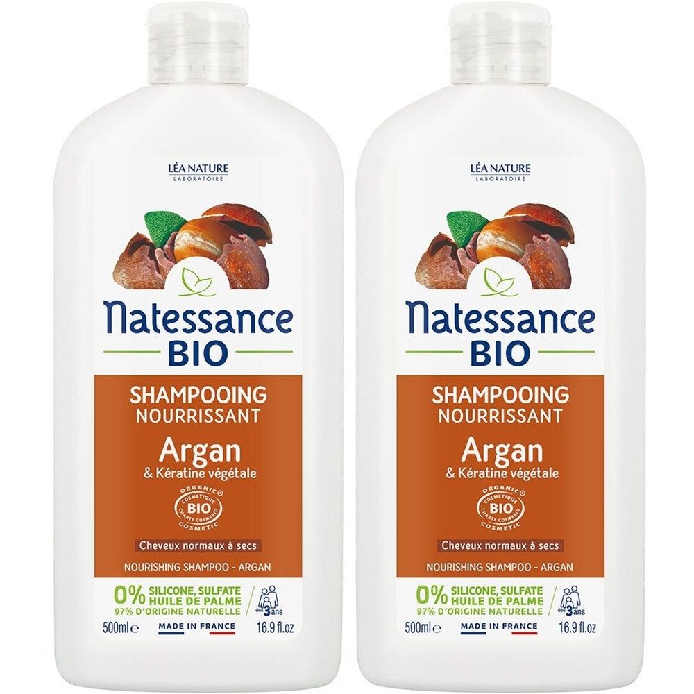 Deux flacons blancs de shampooing. Inscription: Natessance BIO Shampooing Nourrissant Argan & Kératine végétale. Certification bio.