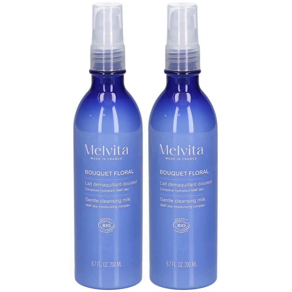 Deux flacons bleus avec vaporisateur. Inscriptions : Melvita, Bouquet Floral, Lait démaquillant douceur, Gentle cleansing milk. Certification Bio.