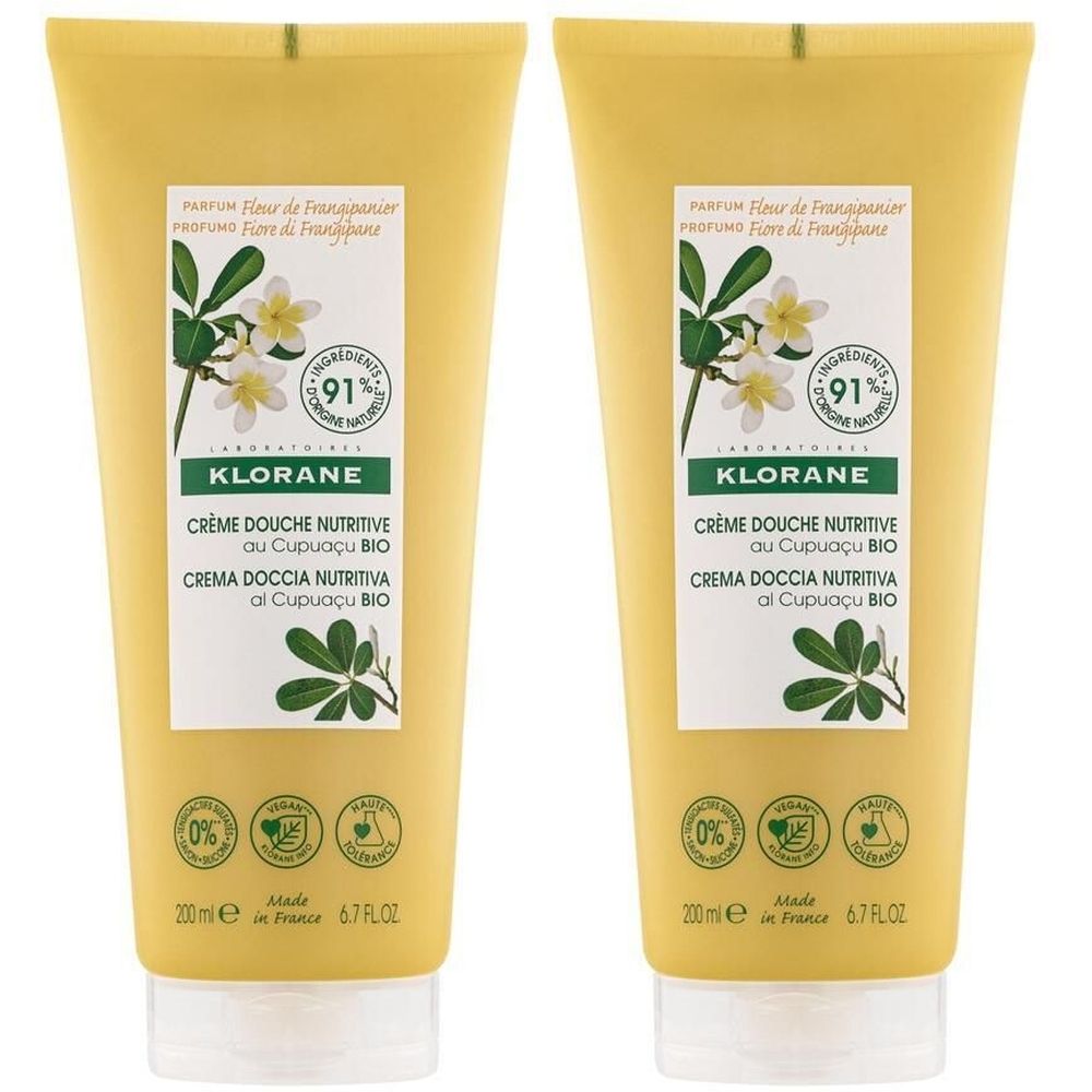 Deux tubes jaunes avec motif floral. Inscription: KLORANE Crème Douche Nutritive au Cupuaçu BIO. 91% d'ingrédients d'origine naturelle.
