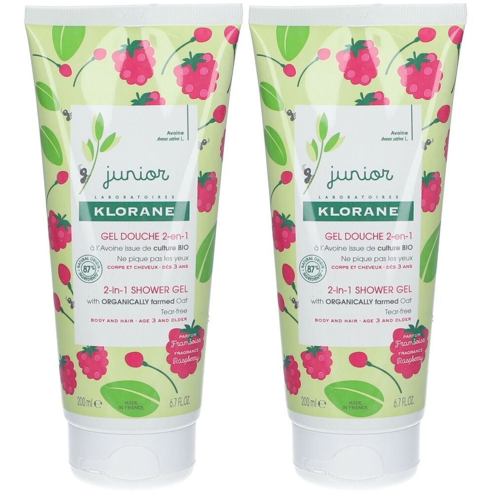 Deux tubes de gel douche KLORANE Junior 2-en-1 Framboise. Design vert et blanc avec des framboises. 200 ml.