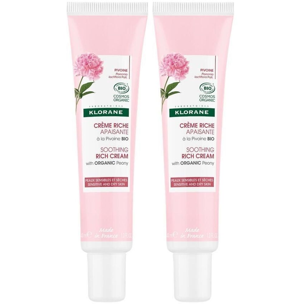 Deux tubes de crème. Tubes roses avec motif floral et texte. Contient de la pivoine bio. Pour peaux sensibles et sèches.