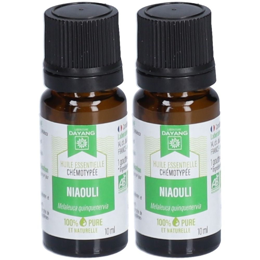 Deux flacons en verre brun avec bouchon noir. Étiquettes avec "DAYANG", "NIAOULI" et "100% PURE".