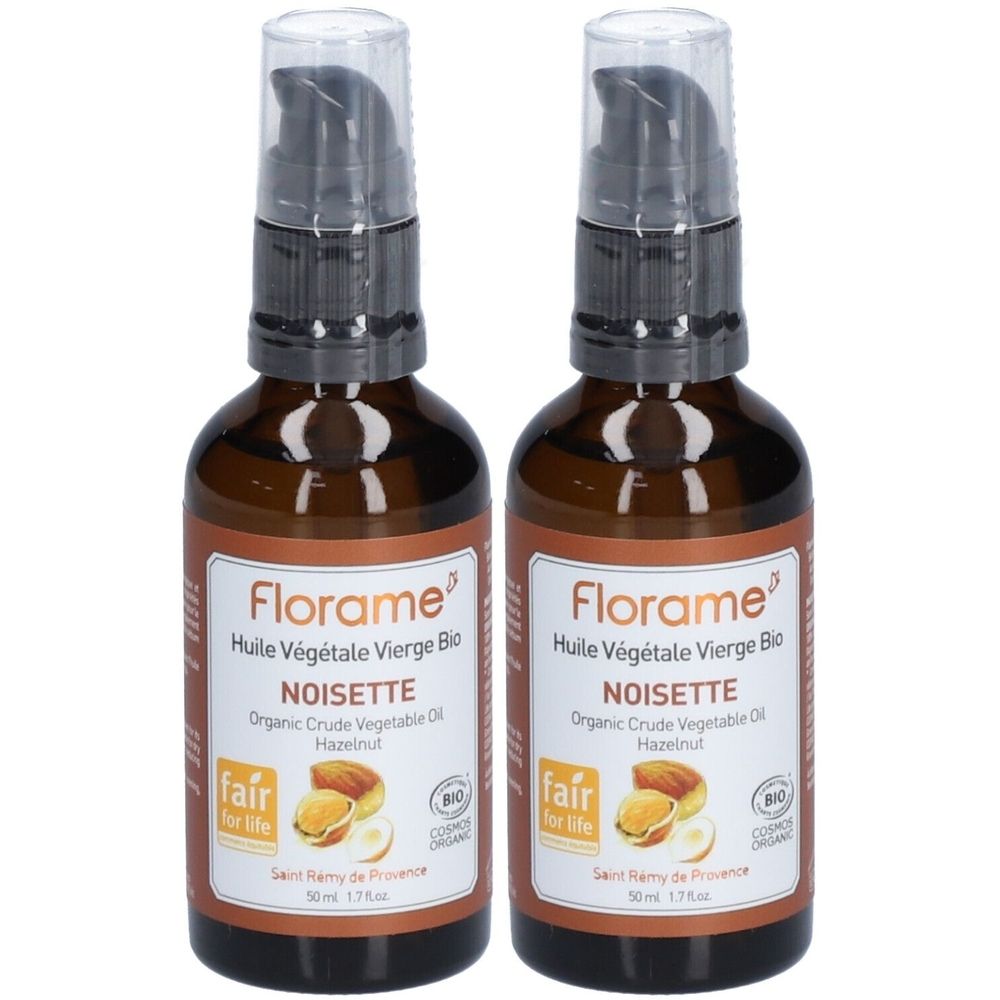 Deux flacons en verre brun avec pompe doseuse. L'étiquette indique "Florame Huile Végétale Vierge Bio Noisette".