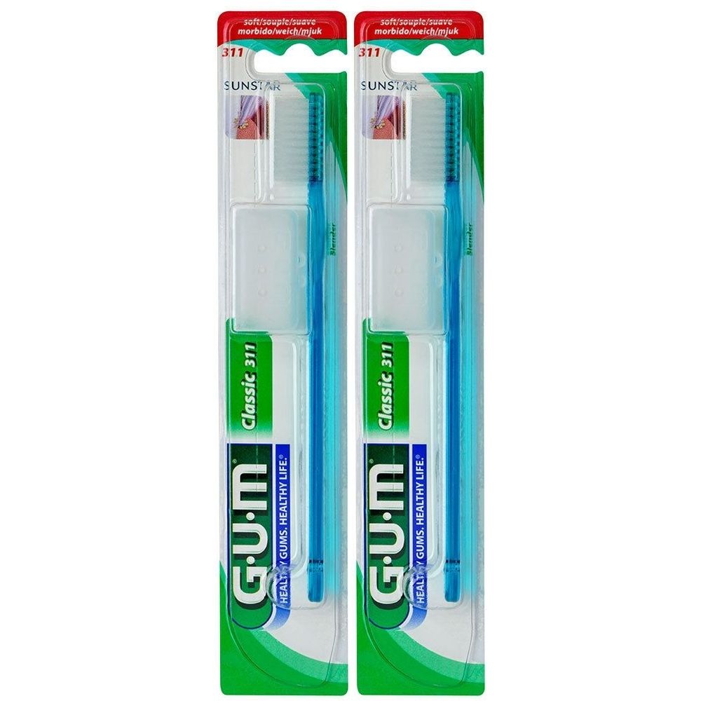 Deux brosses à dents bleues dans leur emballage. Marque G.U.M, Classic 311 et SUNSTAR. Têtes étroites.