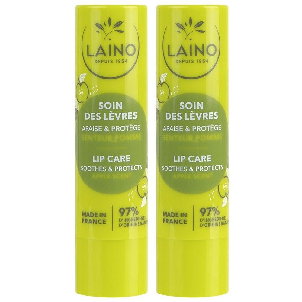 Deux sticks de soin des lèvres. Tubes vert clair avec étiquette blanche. Texte: LAINO, Soin des lèvres, Apaisé & Protège, Senteur Pomme.