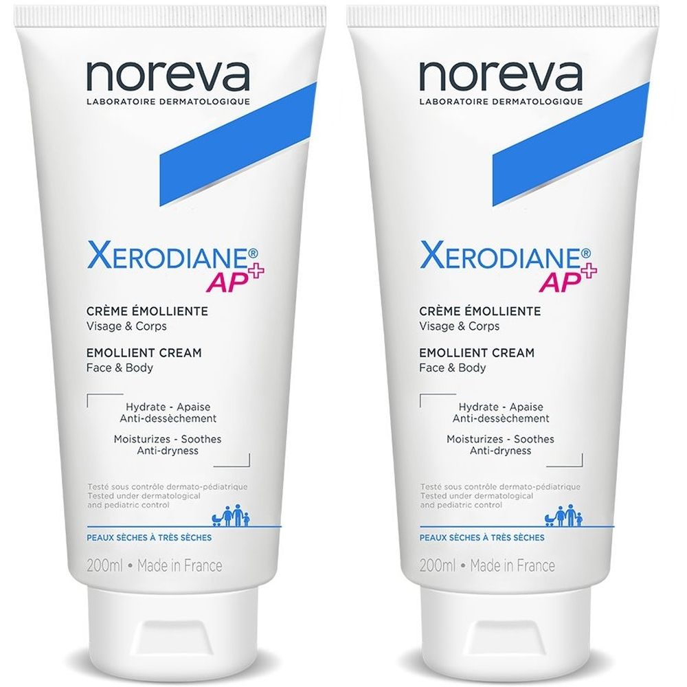 Deux tubes blancs avec des accents bleus. Inscription : Noreva, Xerodiane AP+, Crème émolliente, Visage & Corps, EMOLLIENT CREAM, Face & Body.