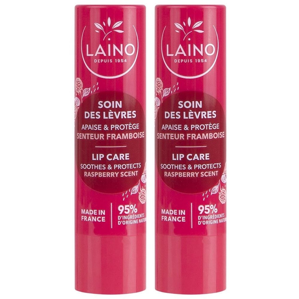 Deux sticks de soin des lèvres. Inscription: LAINO, SOIN DES LÈVRES, SENTEUR FRAMBOISE. Contient 95% d'ingrédients d'origine naturelle. Fabriqué en France.
