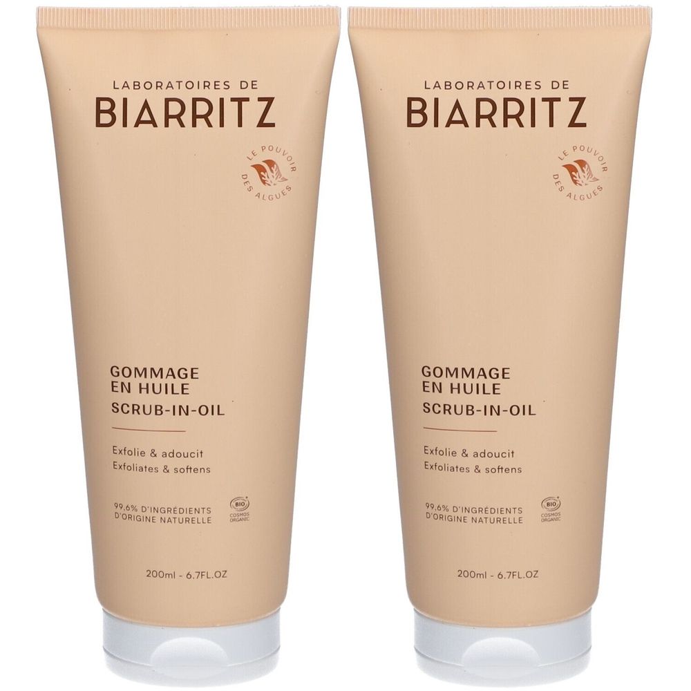 Deux tubes de gommage corporel. Tubes beiges avec bouchons blancs. Inscription: Laboratoires de Biarritz, Gommage en Huile, Scrub-in-Oil.