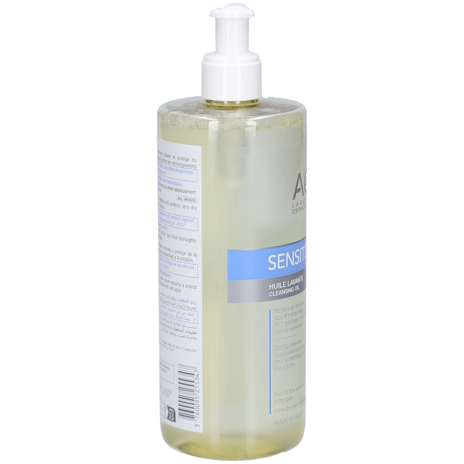 Flacon transparent avec pompe. Inscription: ACM, SENSITELIAL AD, HUILE LAVANTE. Étiquette avec texte.