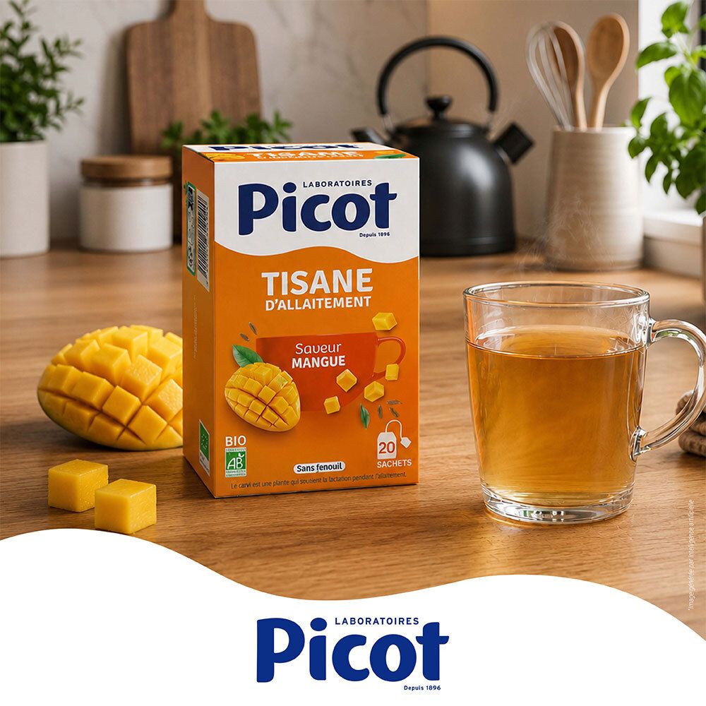 Picot Tisane d'allaitement Mangue préparée dans une tasse, à côté de la boîte et mangue fraîche.