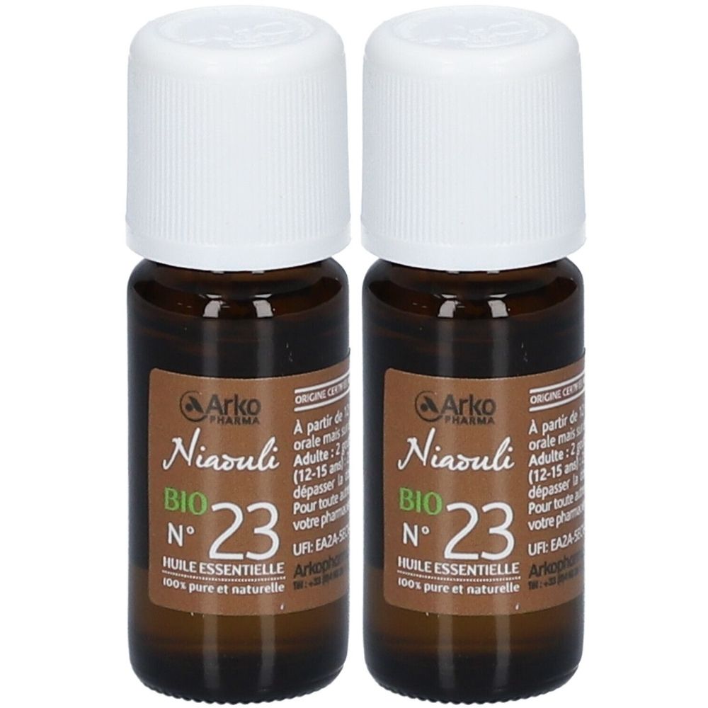 Deux flacons en verre brun avec bouchons blancs. Étiquettes : "Niaouli BIO N°23". Huile essentielle.