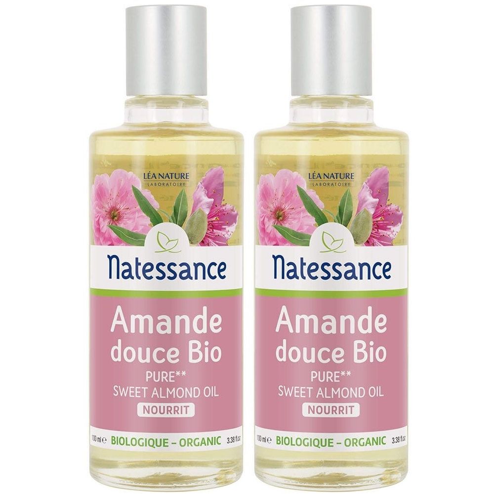 Deux flacons avec bouchons argentés. Inscription: Natessance, Amande douce Bio, Pure Sweet Almond Oil, Nourrit. Décor floral.