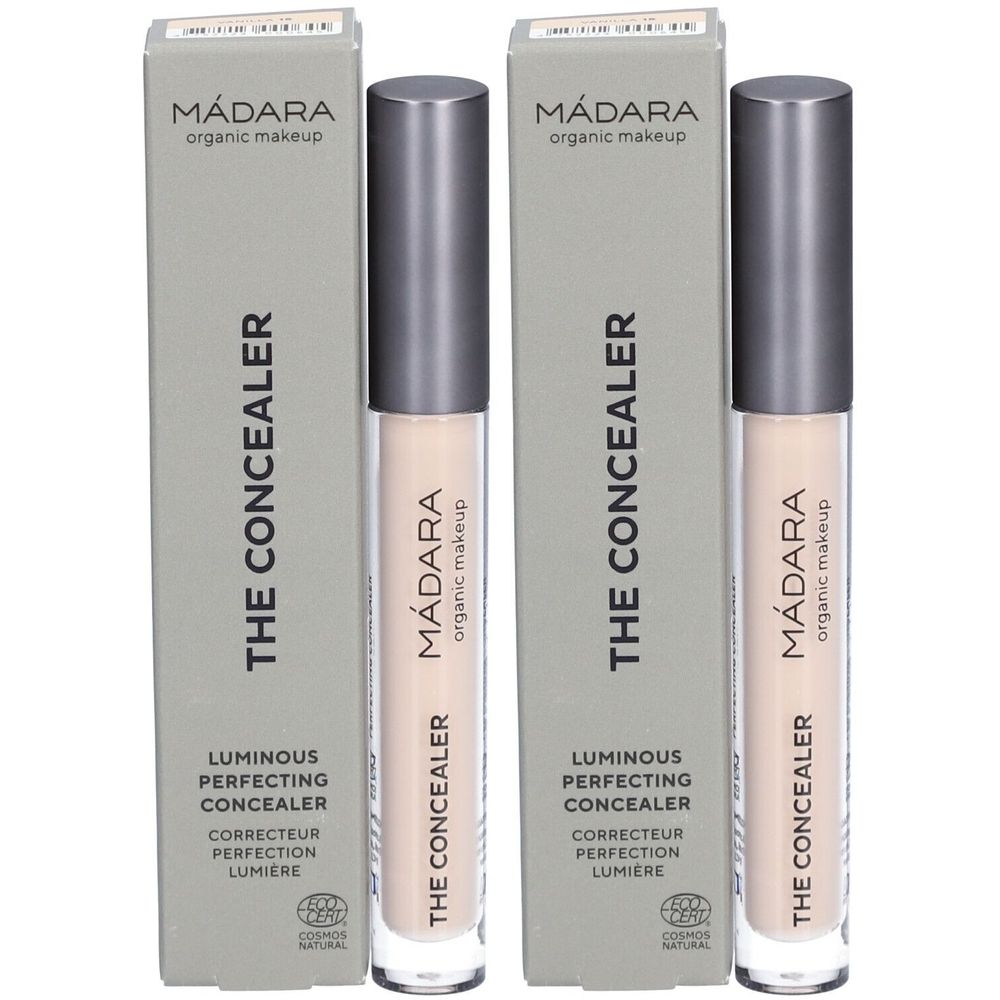 Deux tubes de correcteur et leurs emballages. Sur les emballages, on peut lire "Mádara", "THE CONCEALER" et "Luminous Perfecting Concealer".