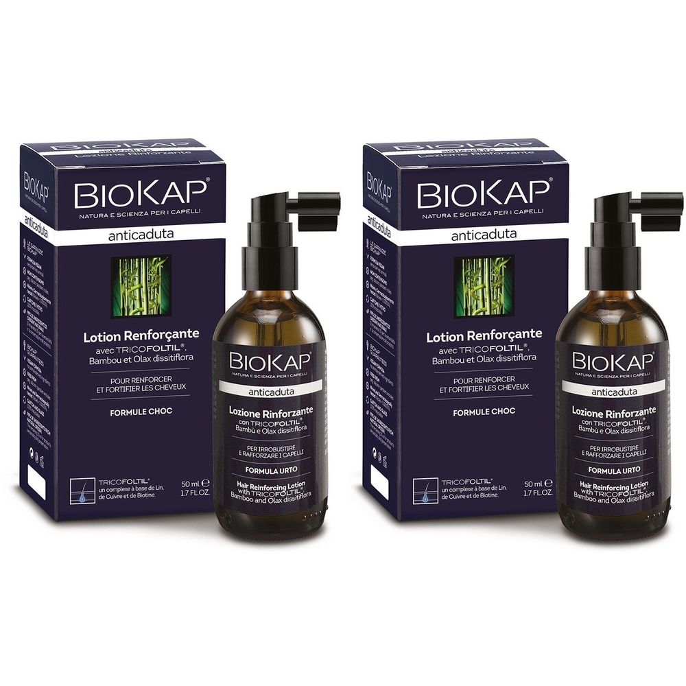 Deux flacons et boîtes BIOKAP. Flacons marron foncé avec vaporisateur noir. Sur les flacons, "Lotion Renforçante". Boîtes bleues avec texte blanc.