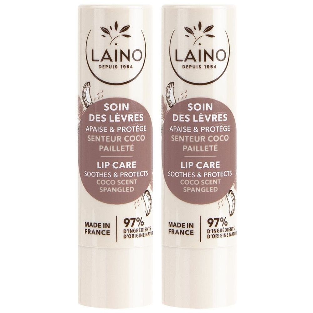 Deux sticks à lèvres. Bâton blanc avec texte: LAINO, SOIN DES LÈVRES, LIP CARE. Fabriqué en France. 97% d'ingrédients d'origine naturelle.