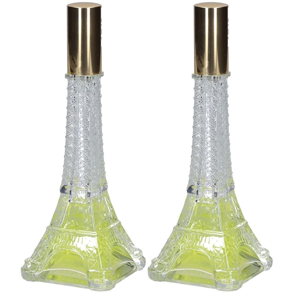 Deux flacons en forme de tour Eiffel. Verre, liquide jaune, bouchon doré. Design décoratif.