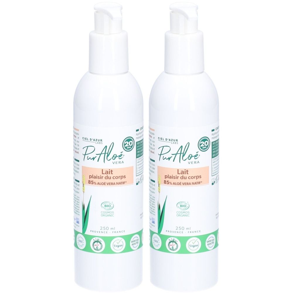 Deux flacons blancs avec pompe. Inscription: Pur Aloé Lait, 85% Aloe Vera. Avec label bio et autres logos.