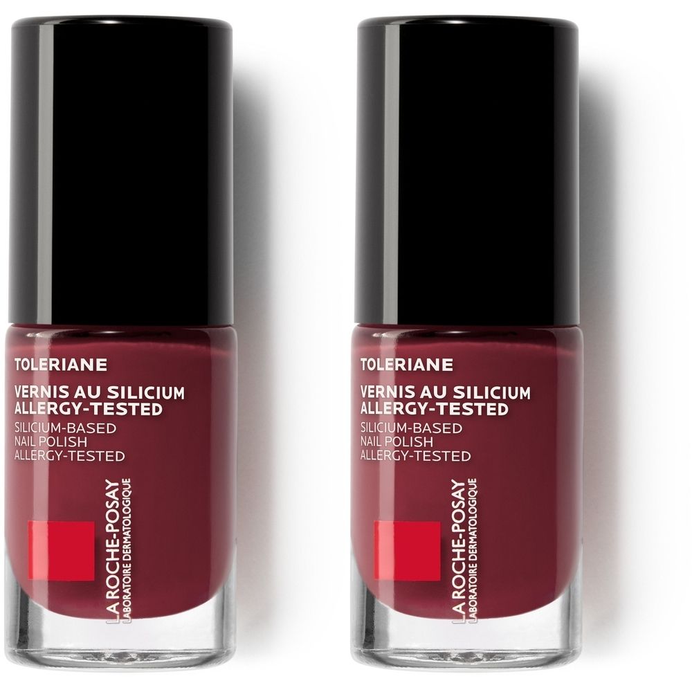 Deux flacons de vernis à ongles rouge foncé. Bouchon noir, flacon transparent. Inscription : Toleriane, Vernis au Silicium, Allergy-Tested.