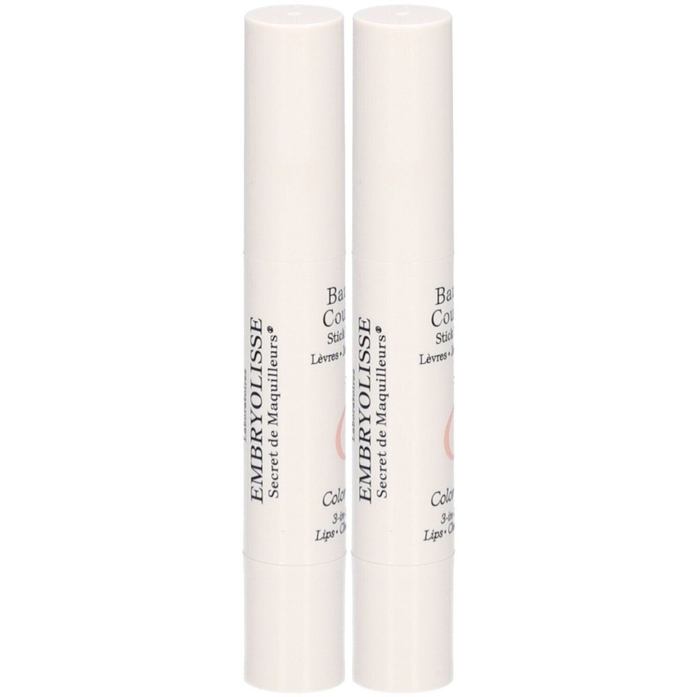 Deux sticks de baume à lèvres blancs. Inscription EMBRYOLISSE. Nom du produit et couleur indiqués sur les sticks.