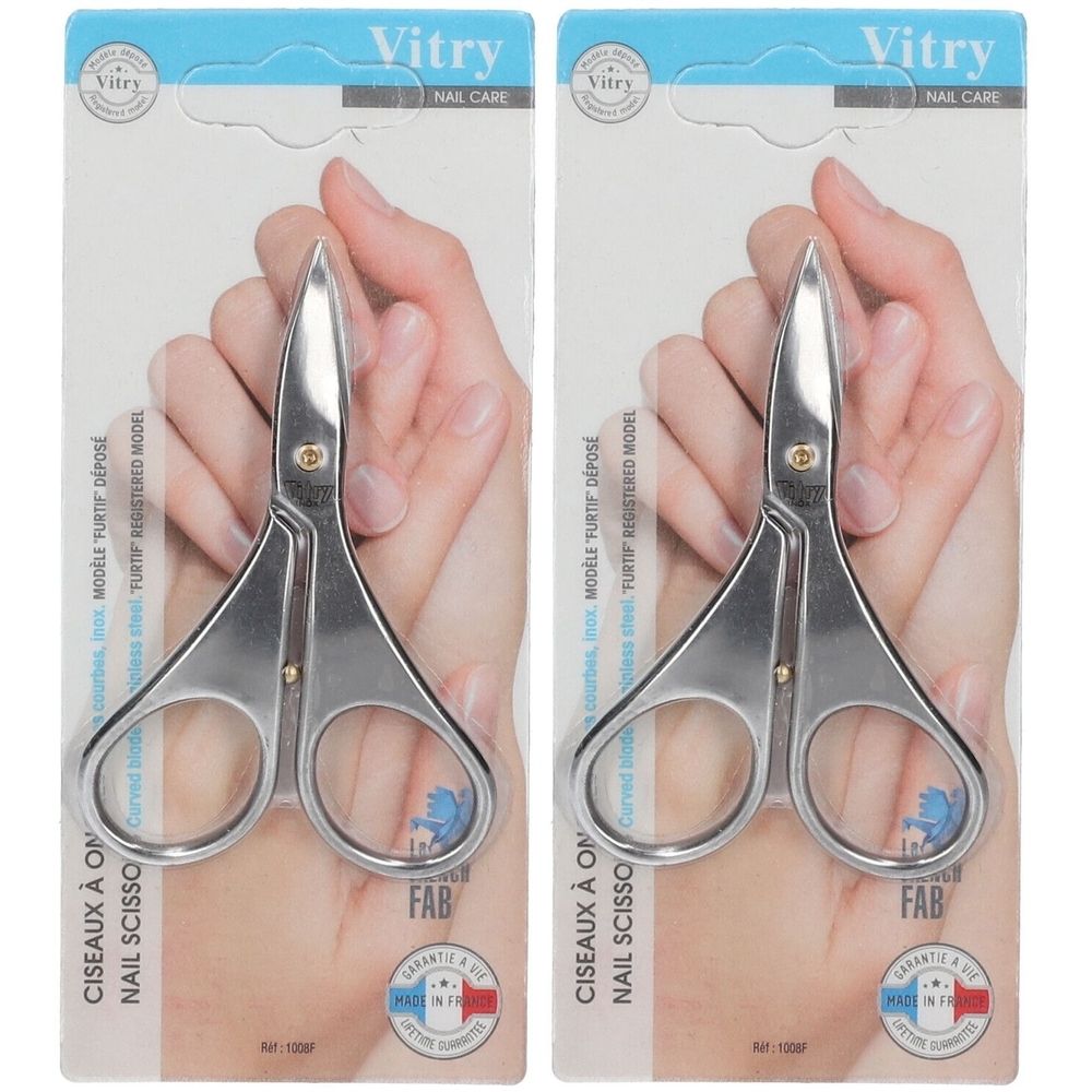 Deux ciseaux à ongles argentés, emballés. Marque Vitry. Lames courbes pour gaucher. Inscription : Ciseaux à ongles.